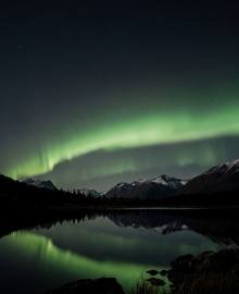 The wallpaper “Aurora over the Lake” as a watch face: the crop lands on the aurora, not on the dark lake.
